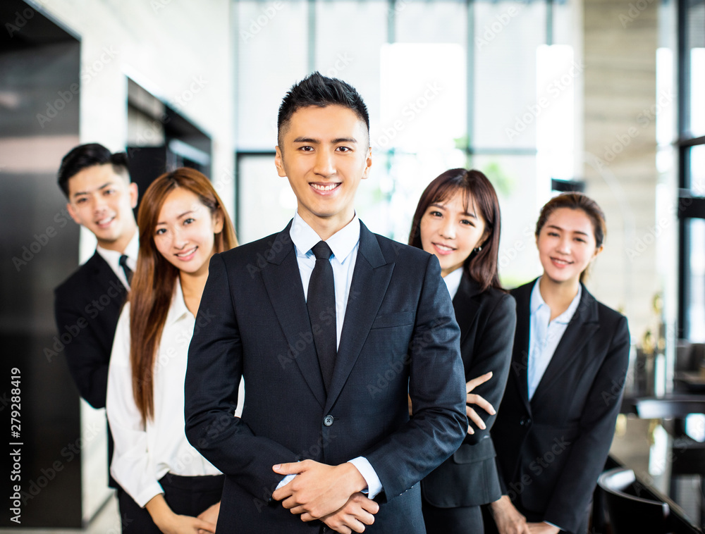 confident asian business team stands in office confident asian business team stands in office