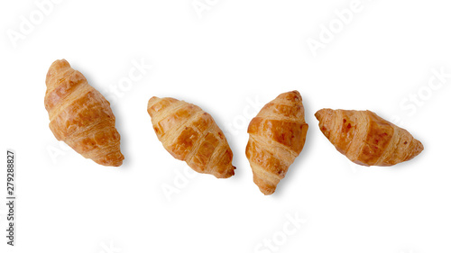 Fresh croissants isolated on white background. Top view.