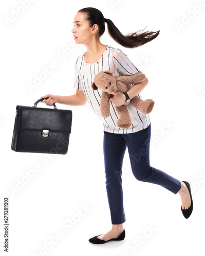 Running young businesswoman with toy briefcase on white background