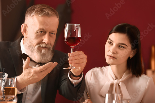 Mature sommelier with his s...