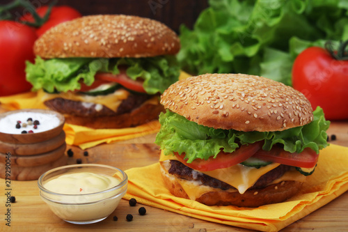 Two fresh hamburgers with vegetables 