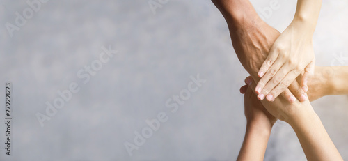 Top view of business people put hands together. Team work and unity business concept