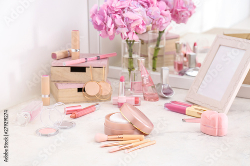 Fotografering Makeup cosmetics with brushes on dressing table