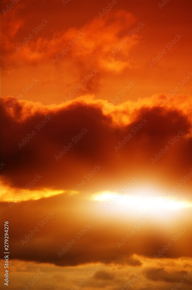 Fototapeta premium Red sunset, rich dark clouds, rays of light