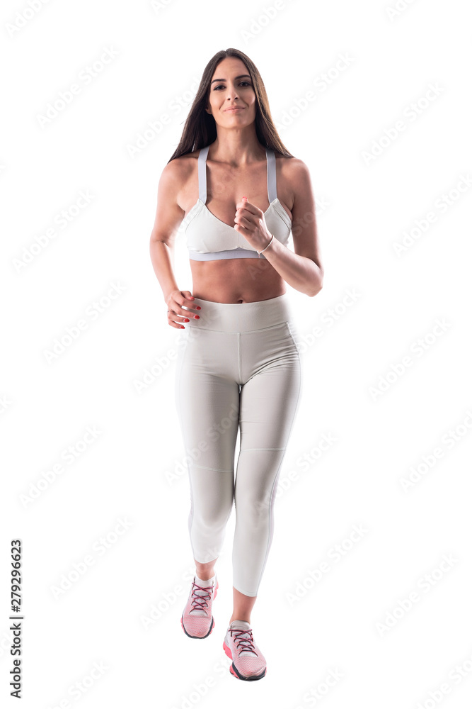 Front view of young fit woman jogging in sporty clothes. Full body isolated on white background. 
