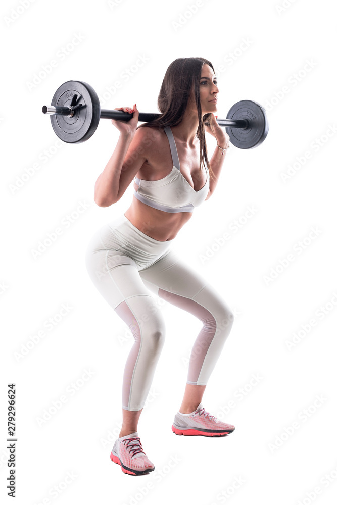 Obraz premium Motivated confident fitness attractive woman doing gym squat exercises with barbell. Full body isolated on white background.