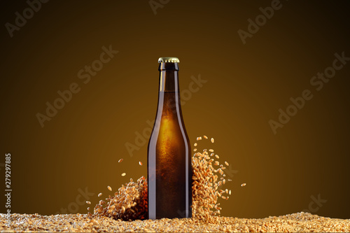 Brown beer bottle with reflections  on a dark studio umber  background with scattering wheat grains Fototapeta