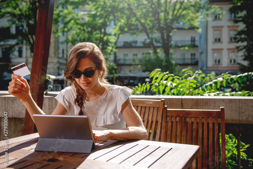 Young woman Paying online with credi card 