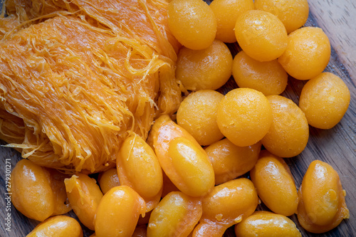 Close up of famous Thai dessert, Thongyod or sweety gloden drop or egg yoke fudge balls, Foythong or sweet egg floss and Medkanhoon made of egg and mung beans photo