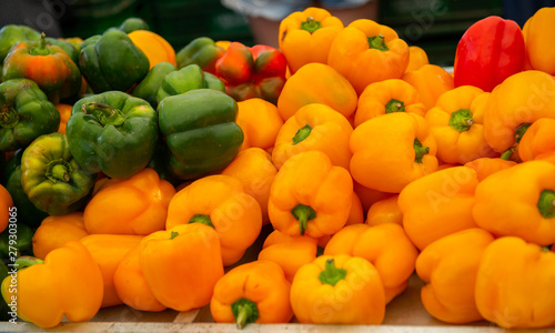 Fresh raw sweet peppers sold on outdoor market. Farm seasonal spanish fruits and vegetables