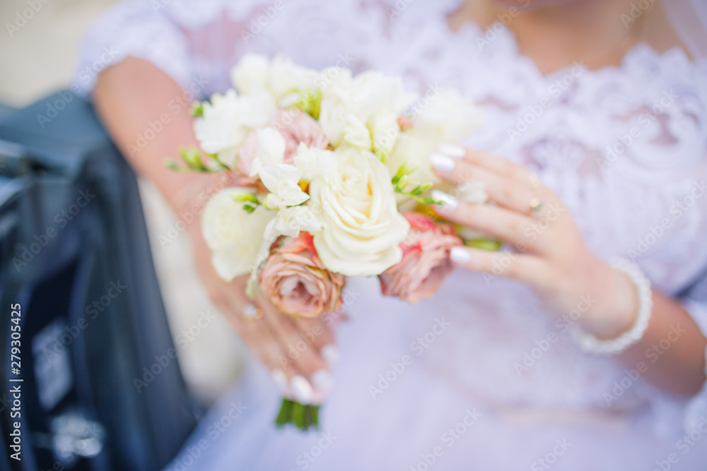 blurred background wedding theme. bride's bouquet and hands closeup. Wedding day blurred background wedding theme. bride's bouquet and hands closeup. Wedding day