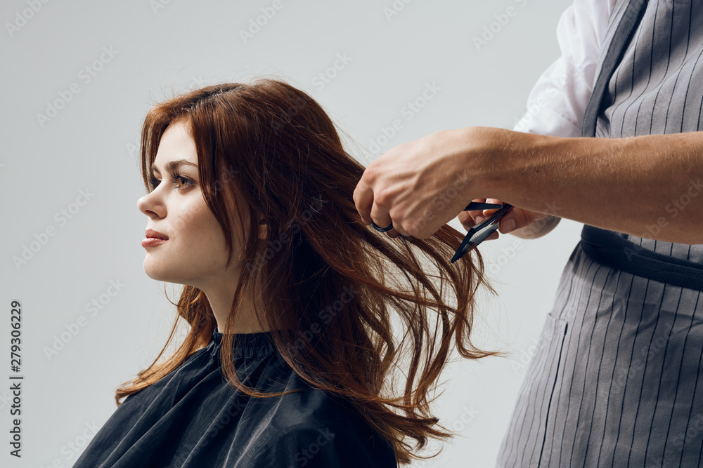 Fototapeta premium young woman combing her hair