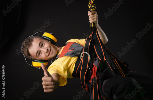 child the Builder costume posing with a work tool photo