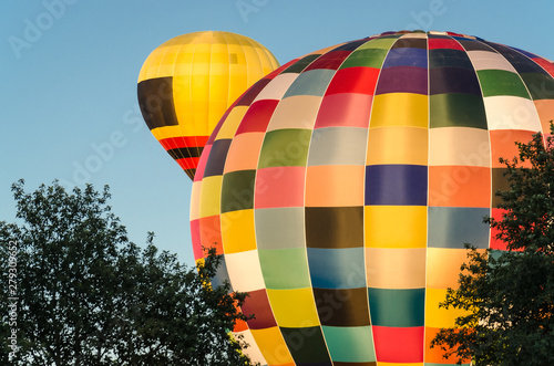 FESTIVAL OF BALLOON SPORT LOVERS - Flight of balloons on a blue sky photo