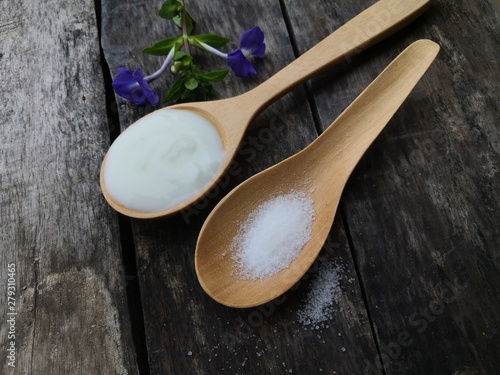 spoon and fork on wooden background photo