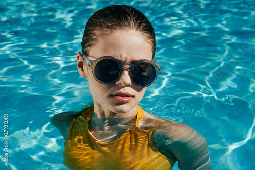 woman in sunglasses in swimming pool
