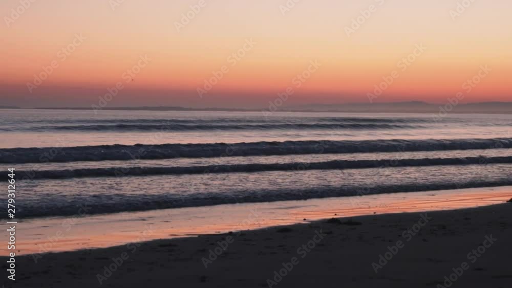 Majestic purple horizon over the sea, waves splashing on sandy beach on windy day right after sunset.Beach Rossbeigh located near to Village Glenbeigh - County Kerry, Ireland Majestic purple horizon over the sea, waves splashing on sandy beach on windy day right after sunset.Beach Rossbeigh located near to Village Glenbeigh - County Kerry, Ireland