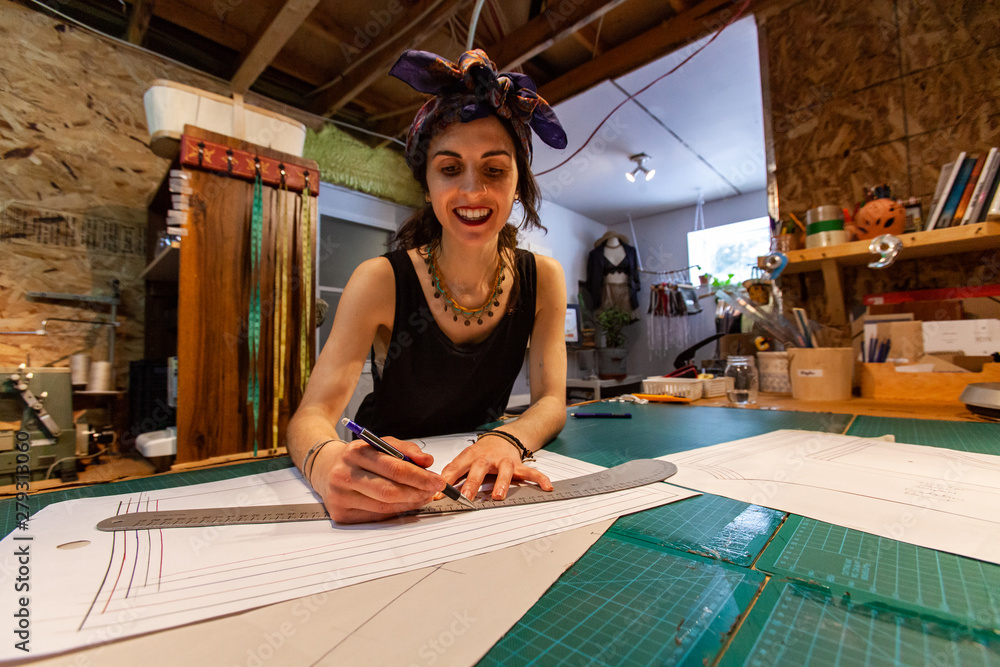 Foto de Fashion design on a grid sketching table. A trendy clothes ...