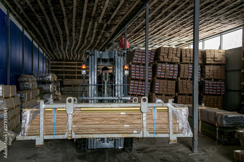 Forklift loader pallet stacker truck at small warehouse