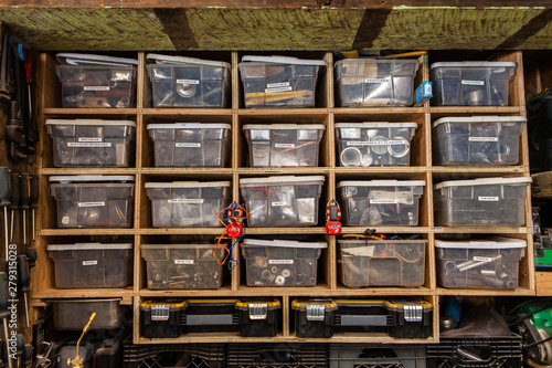 Bild auf Leinwand Metalwork hardware organized in tubs