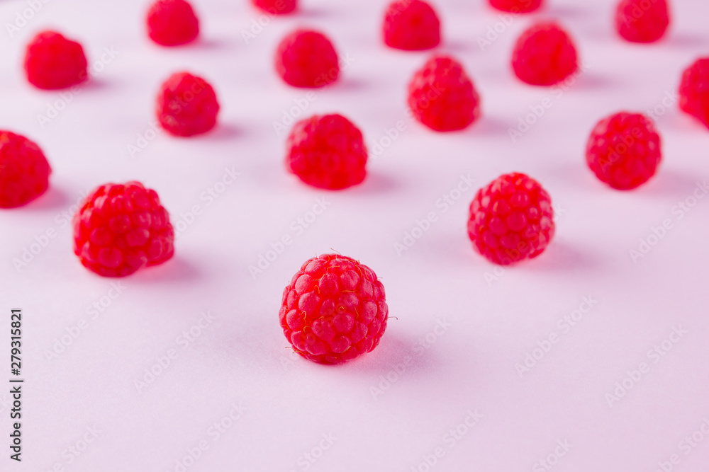 Pattern of raspberries on pink background. Colorful diet and healthy food concept. Background of raspberries. Top view. Flat lay. Copy space Pattern of raspberries on pink background. Colorful diet and healthy food concept. Background of raspberries. Top view. Flat lay. Copy space