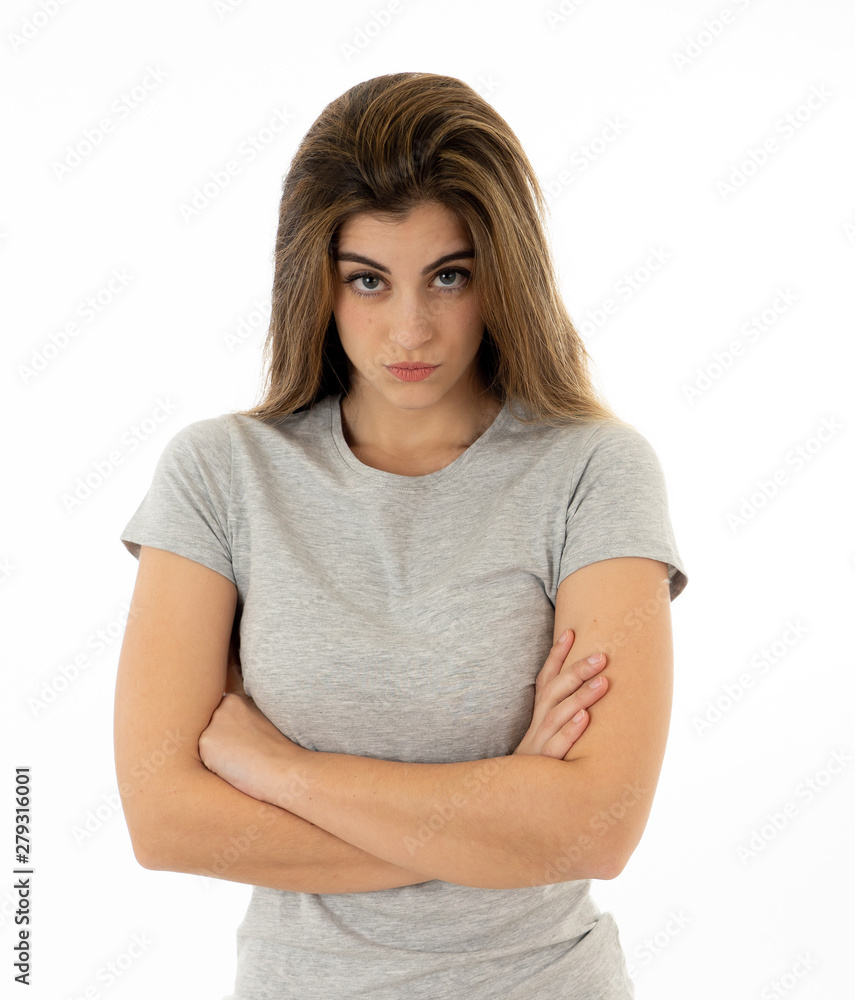Portrait of a beautiful young woman with angry face looking furious. Human expressions and emotions Portrait of a beautiful young woman with angry face looking furious. Human expressions and emotions