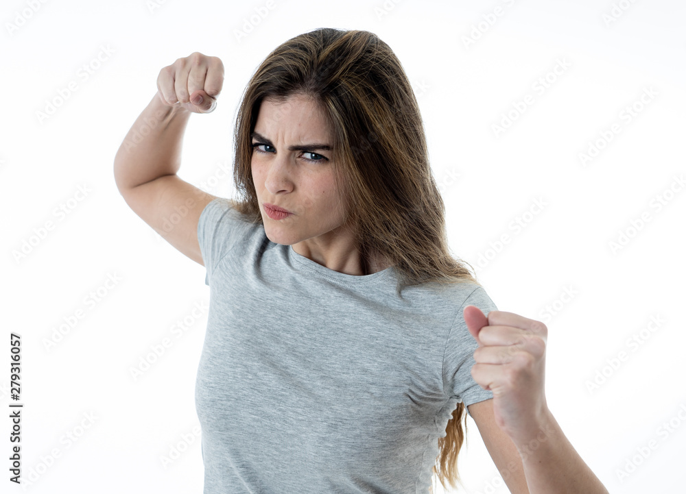 Portrait of a beautiful young woman with angry face looking furious. Human expressions and emotions Portrait of a beautiful young woman with angry face looking furious. Human expressions and emotions