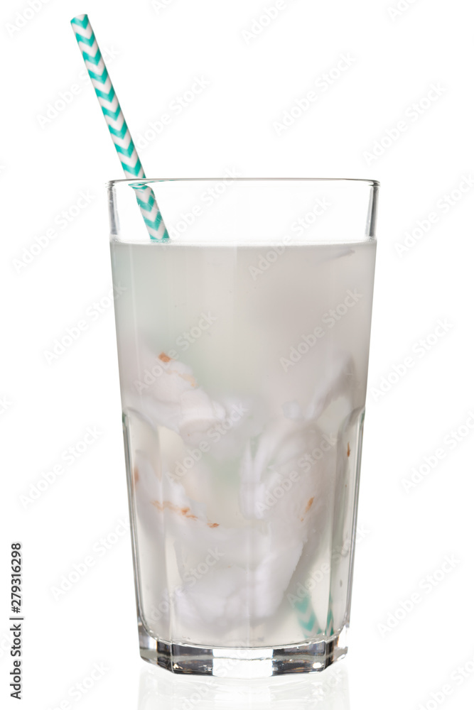 Fresh coconut juice in a glass with coconut white meat isolated on white Fresh coconut juice in a glass with coconut white meat isolated on white