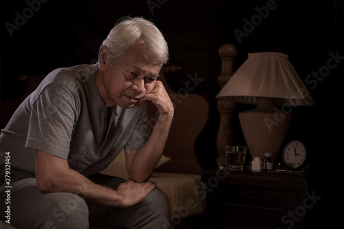 Depressed senior person sitting in bed cannot sleep from insomnia © amenic181