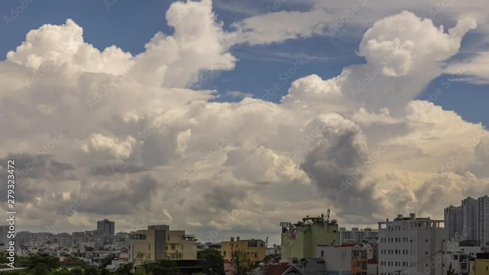 Part 1 of 4.  A series of 4k timelapse videos of an afternoon storm during the wet season in a residential area of a modern asian city (Ho Chi Minh City or Saigon) in Vietnam