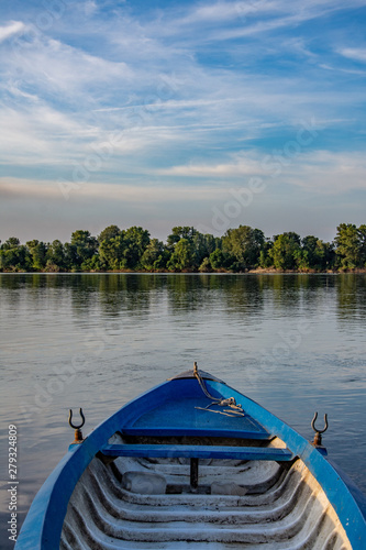 Fototapeta Naklejka Na Ścianę i Meble -  Boat stands on the river bank