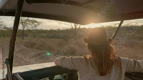Woman on a safari trip in Masai Mara park, Kenya