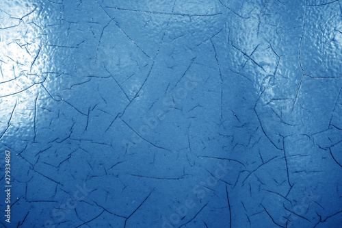 Cracked paint texture in navy blue color. © pavelalexeev