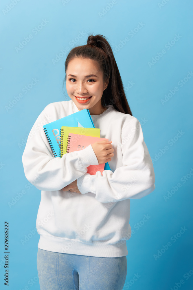 Nice female student smiling and looking at camera