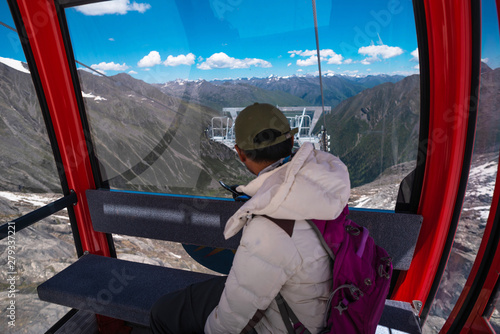 the tourist in cable car with the snow mountains of the Dag glacier national park at Chengdu China