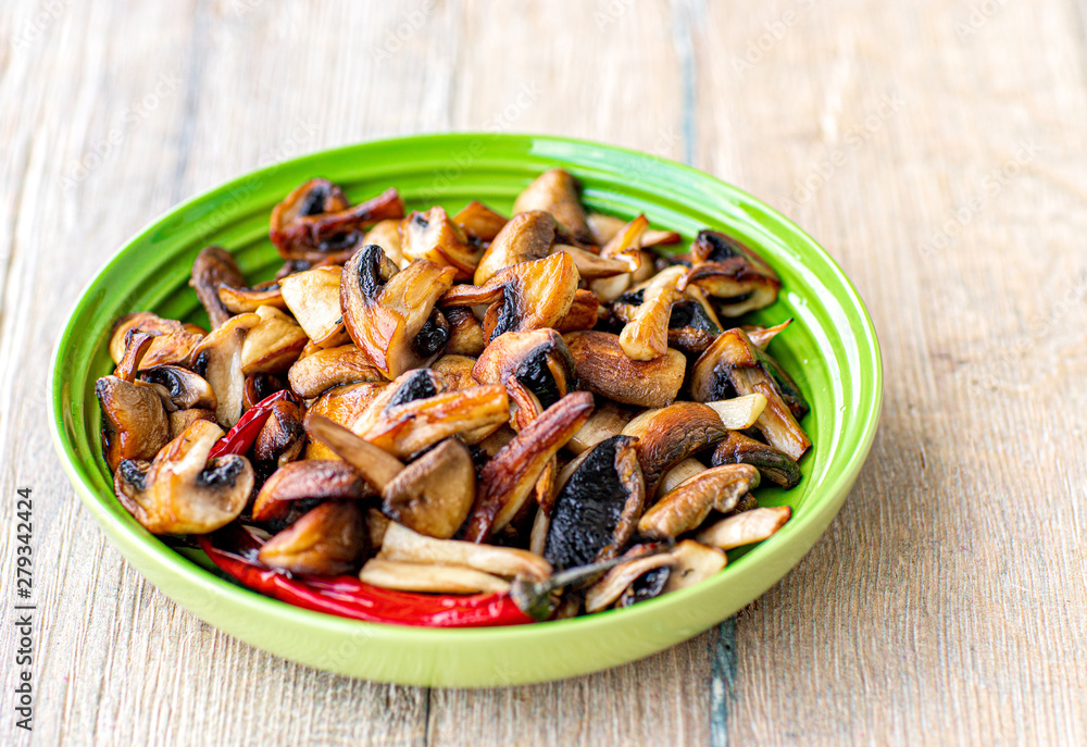 Fried mushrooms with chilli and seasonings. Fried mushrooms with chilli and seasonings.