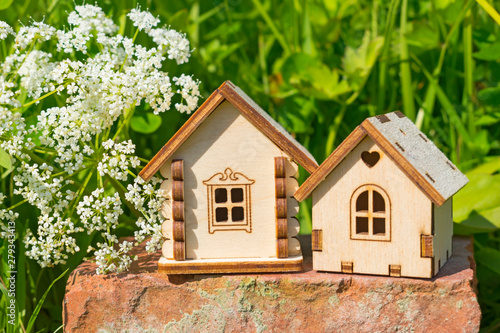 Eco life concept, wooden house on the natural background.