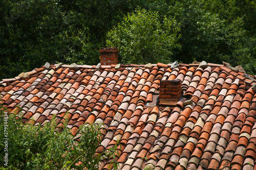 texture of old tile roof. chimney on tiled roof