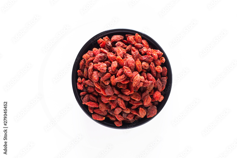 Super brain food dry Goji berry in black ceramic cup isolated on white background with copy space Super brain food dry Goji berry in black ceramic cup isolated on white background with copy space
