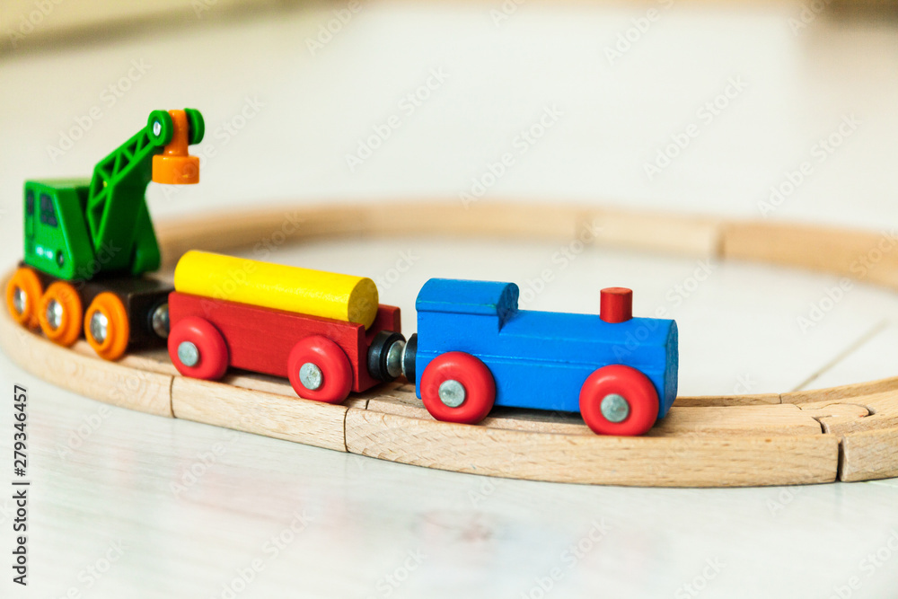 Child'd wooden train on the white floor
