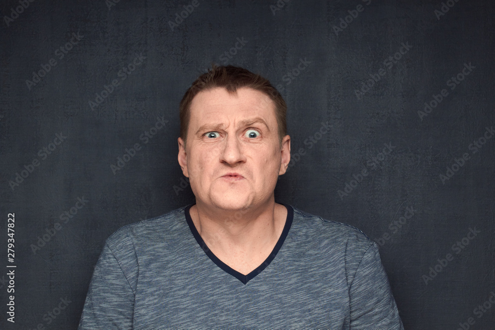 Obraz premium Portrait of frightened man with shocked expression