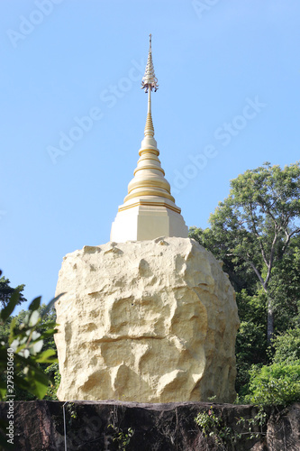 Golden pagoda sculpture,stone carving at Wat Tham Pha Daen.Sakon Nakhon province,Thailand photo