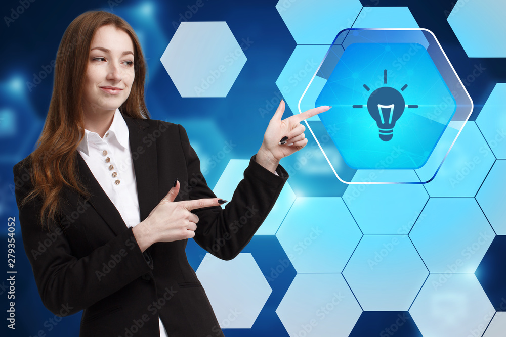 The concept of business, technology, the Internet and the network. A young entrepreneur working on a virtual screen of the future and sees the inscription: The concept of business, technology, the Internet and the network. A young entrepreneur working on a virtual screen of the future and sees the inscription: