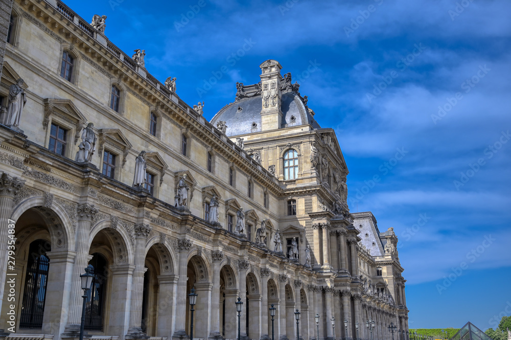Paris, France - April 21, 2019 - A view of the Louvre Museum, the world's largest art museum and a historic monument in Paris, France, on a sunny day.