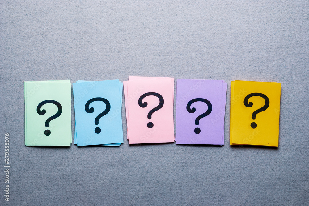 Row of different colored cards with question marks Row of different colored cards with question marks