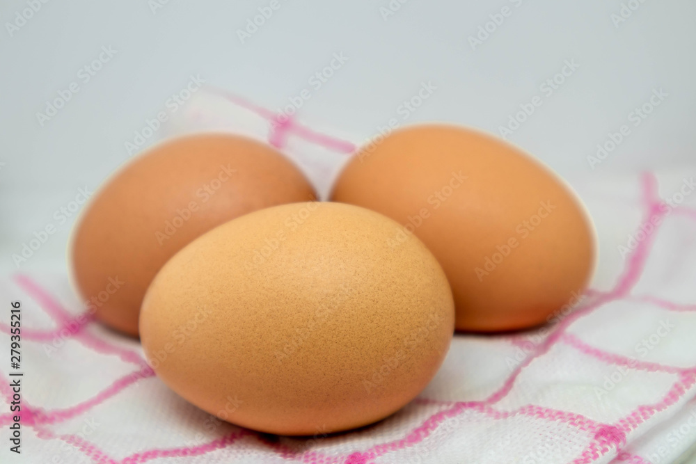 Three eggs on the fabric Three eggs on the fabric