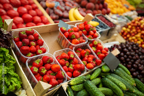 Fototapete A lot of strawberries in boxes on sale at farms market