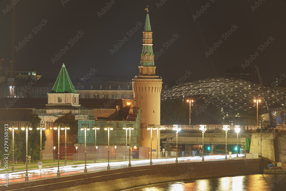 Long exposure image of Moscow. Cityscape in the summer night. Moscow Kremlin Towers and Moskva River in city reflections. Repair  jobs in the city. High resolution image.