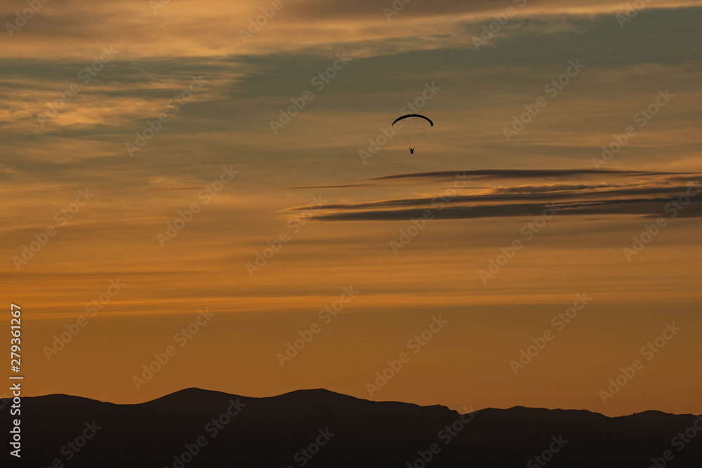 Sunset and paraglider