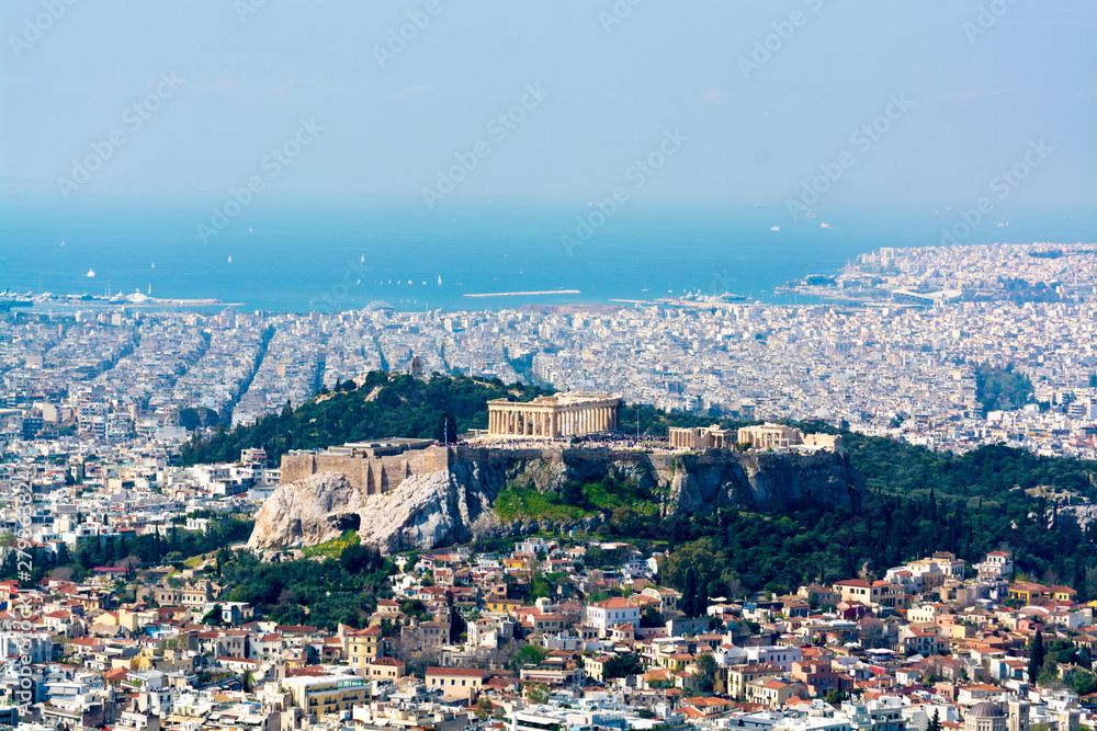 Athens in spring, view from hill,  cityscape with Acropolis, streets and buildings, ancient urbal culture